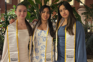 Three seniors with sashes over their shoulders